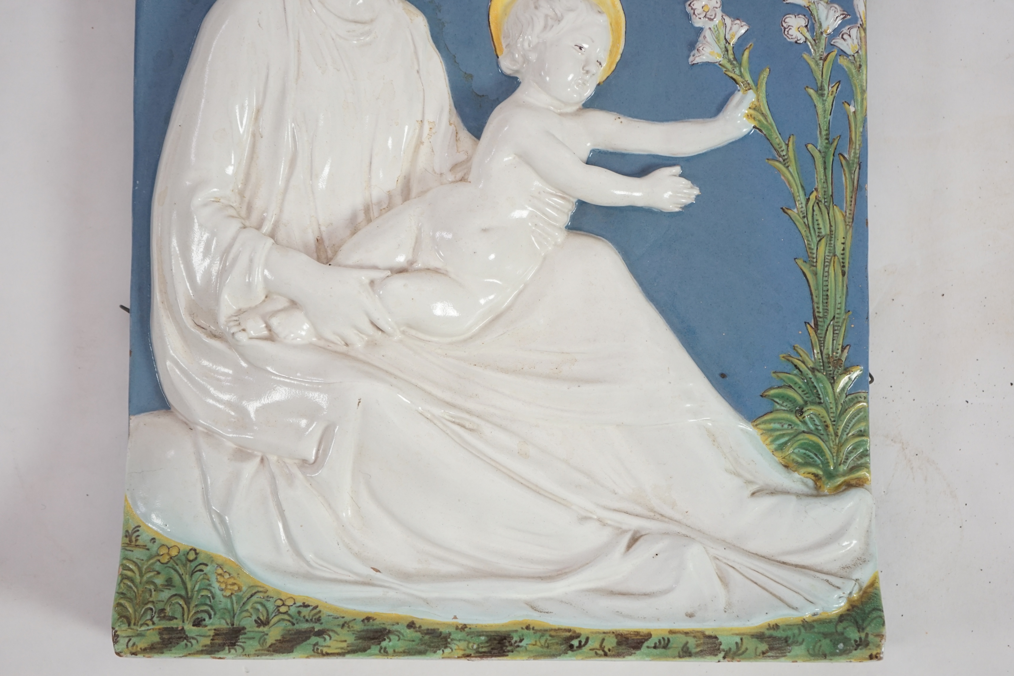 A Cantagalli maiolica wall plaque depicting the Virgin and child, 19th century, after Della Robbia